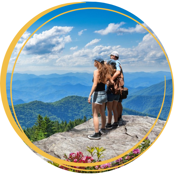 Group hiking and overlooking the mountains.